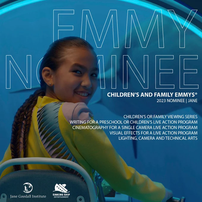A photo of a teenager with tan skin and long, brown hair turning around in her seat to smile at the camera. Behind her are the words, "Emmy Nominee." Next to her are the words, "Children's and Family Emmys—2023 nominee: Jane" and a list of the nominations. 