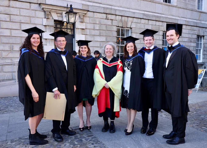 I am in the middle of the six Gallaghers. We are all wearing our gowns. In Front Square