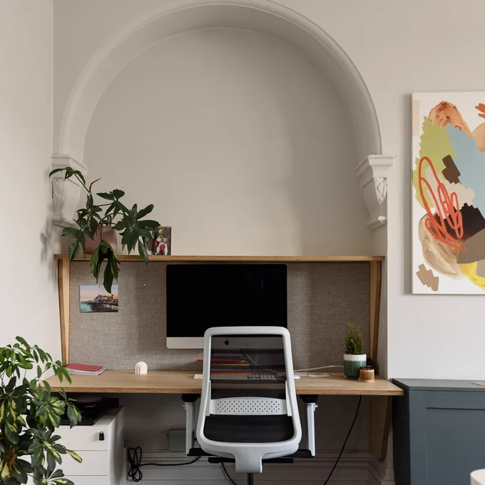 A dedicated desk set up with a Mac desktop