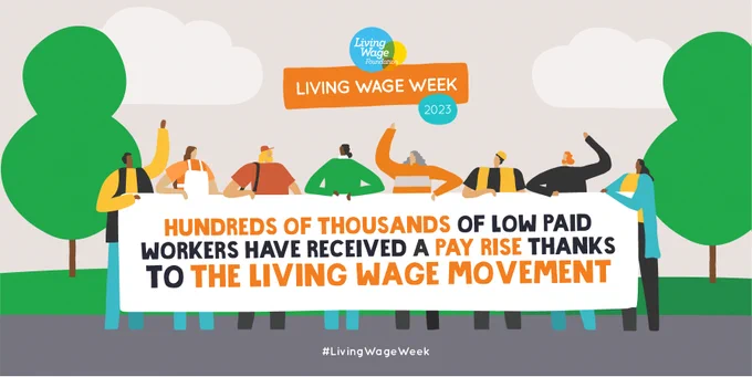 A cartoon-style street scene with a road at the bottom and two trees at either side of a group of workers of all kinds holding a banner which reads ‘Hundreds of thousands of low paid workers have received a pay rise thanks to the Living Wage movement’. #LivingWageWeek.