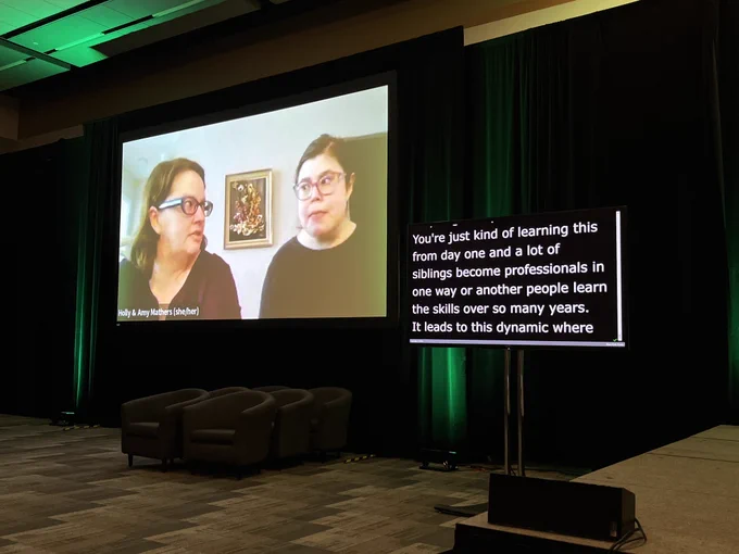 Amy and Holly Mathers sharing about their relationship on a video screen