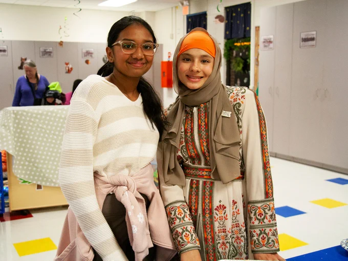 Two Rockwood students smile at their school's International Night.