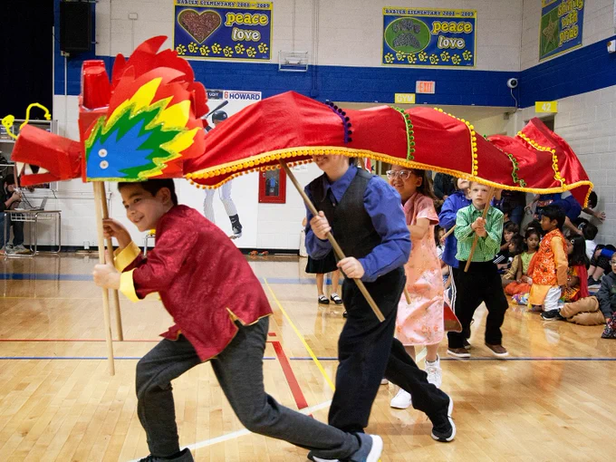Rockwood students hold a fabric dragon aloft at their school's International Night.
