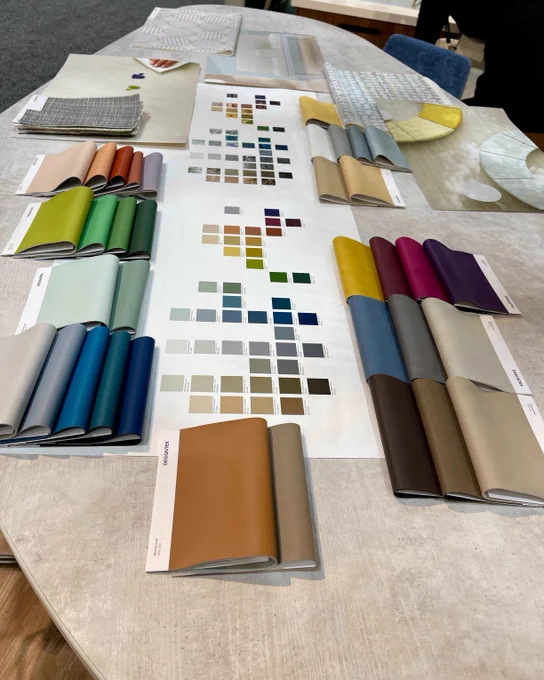 Swatches of varying brightly colored to neutral Designtex fabrics.