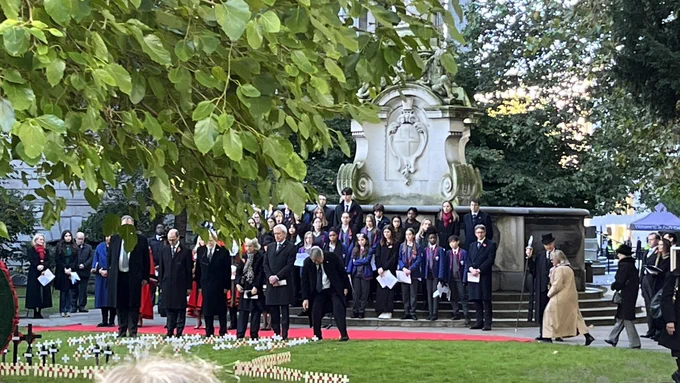 Masters lining up ready to place memorials.