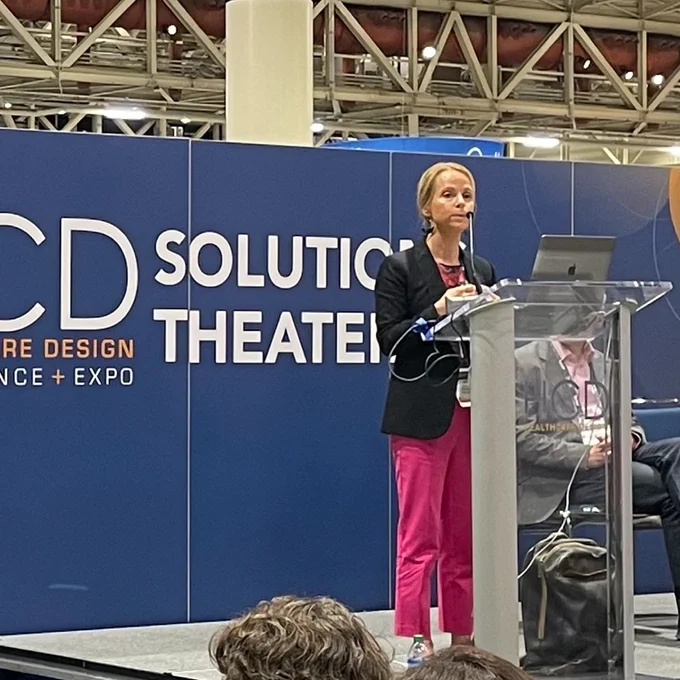 Beth Bronson speaks to an audience at Healthcare Design Conference.
