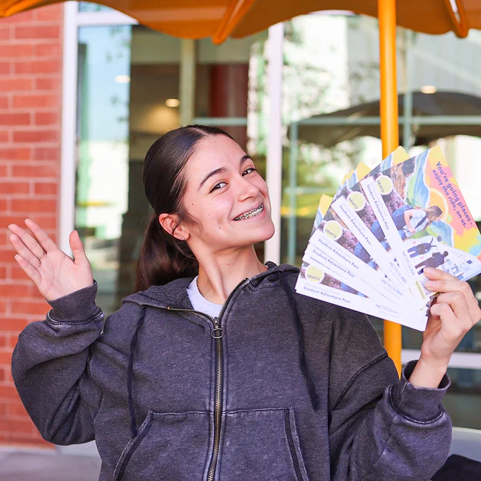 a girl smiling with the student adventure pass