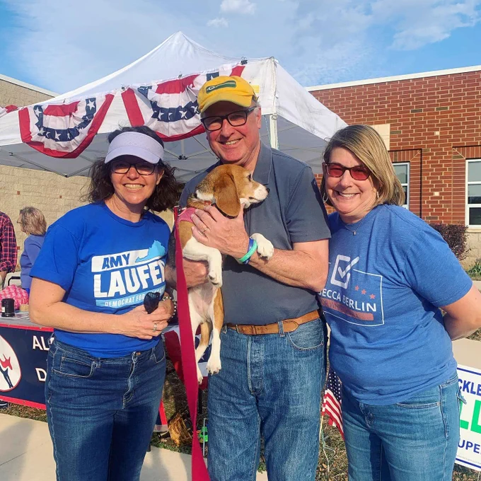 Senator Creigh Deeds at a polling location holding his beagle, Mila, and Amy Laufer and Rebecca Berlin.