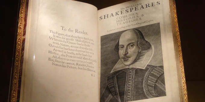 A copy of the First Folio - open at a page with an illustration of William Shakespeare, after an unknown artist (1623). Credit: Folger Shakespeare Library (Creative Commons License).
