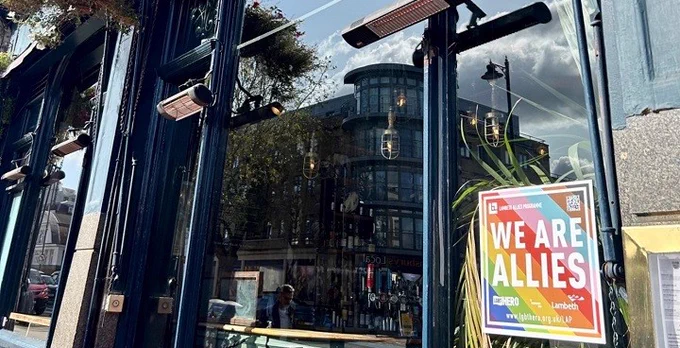 "We are allies" rainbow sticker in the window of the The Railway Tavern, Clapham signals a safe space for LGBTQ  people after training from LGBT HERO & Lambeth Council 