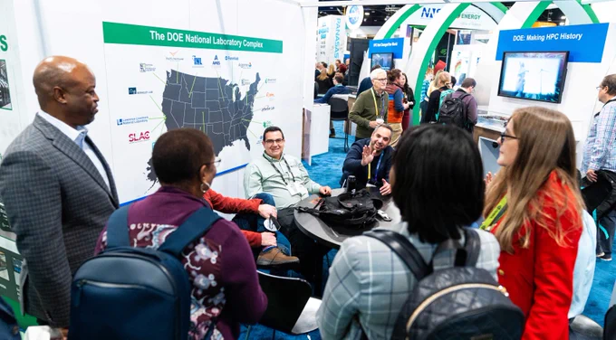 Photo of visitors at DOE's #SC23 booth.