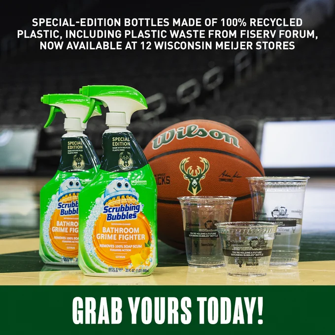 A graphic featuring a photo of two bottles of Scrubbing Bubbles cleaning bottles, three plastic cups and a bucks Basketball on the court at Fiserv Forum. Text on the graphic reads, "Special-edition bottles made of 100% recycled plastic, including plastic waste from Fiserv Forum, now available at 12 Wisconsin Meijer stores. Grab yours today!"