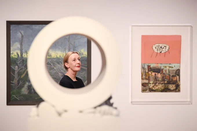 A visitor to the exhibition at the City Art Centre with Kenny Hunter’s work ‘As above so below’.