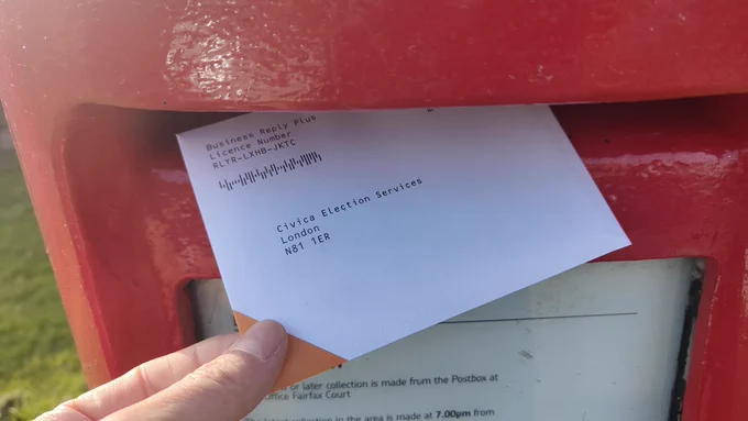 BMA consultant strike ballot envelope being posted in red post box