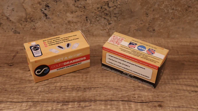 light brown folding cartons on a wooden background.