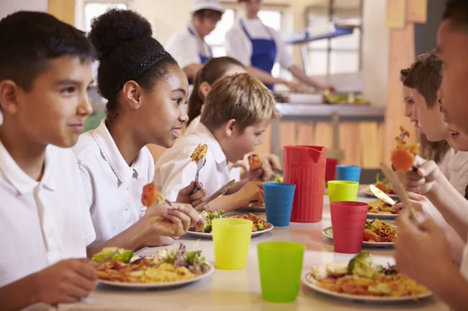 School pupils eating school meals.