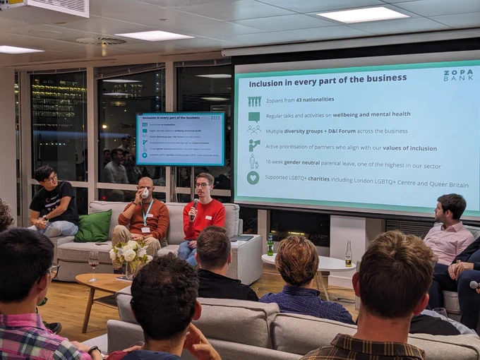 People sat on a sofa talking to the audience