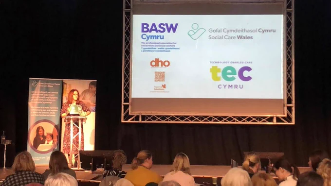 The Llandudno conference stage with a slide showing our sponsors' logos.