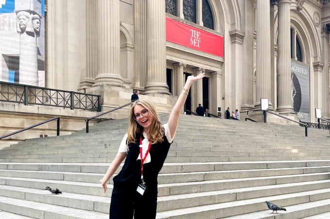Laine Lord standing outside The Metropolitan Museum of Art in New York City.