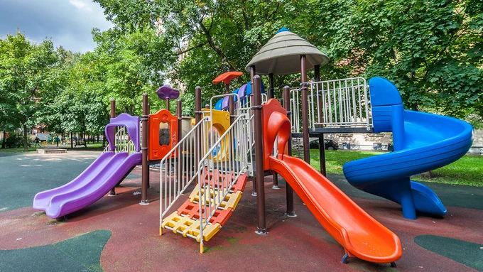Children's outdoor playground with areas of shade