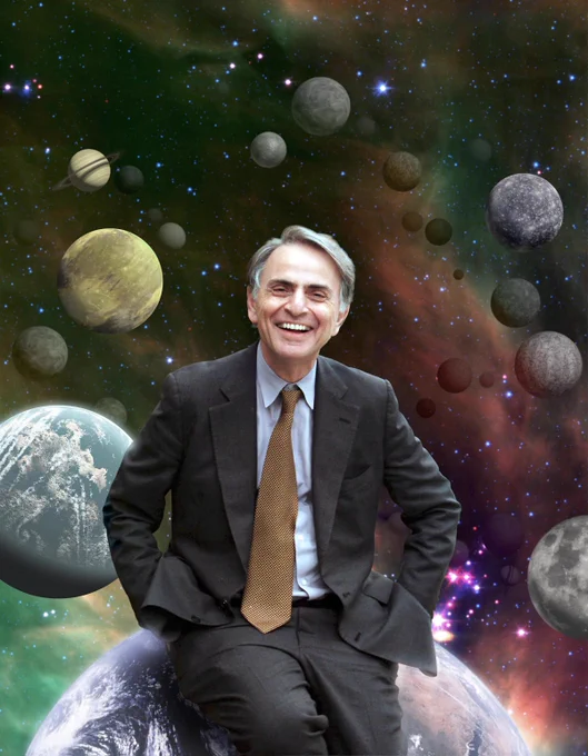 Astronomer and science communicator Carl Sagan smiling with his hands in his pocket wearing a grey suit, blue button up shirt, and brown tie. He's surrounded by an illustration of planets and moons of the solar system.