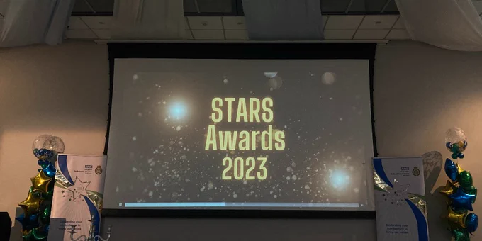 STARS Awards set up of a screen with banners and balloons
