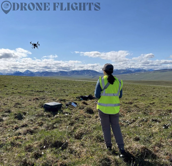 scientist flying a drone