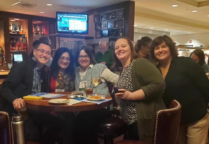 Attendees gathered for a photo at the Happy Hour hosted by CollegeSource during the 2023 WACRAO Annual Conference
