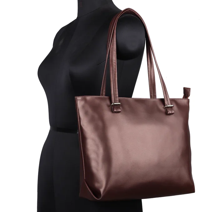 Raizel, Satchel handbags made of premium quality pu-leather, pu-Synthetic. 
SIZE: top length size 14.75" × bottom length size 11.75" × height 10.25" × bottom 4.75"
PICTURE : can be some difference due to photography lighting, make sure before ordering, thank you.
DESIGN : very simple design for all ages, women and girls. 
MATERIAL : premium quality pu leather
COLOUR : metallic brown
HARDWARE : shinny nickel
INNER MATERIAL : polydrill
COLOUR : BEIGE
LARGE CAPACITY :  this prisha Satchel hand bag is one main compartment, you can easily keeping your important things as like laptop 14", dairy, book, hand purse, water bottle, etc. one zipper pocket behind the front with beautiful pu-tie pullar, for small documents like passbook, feesbook, check, bill, etc
INNER : two zipper pockets one zipper pocket in back wall for small ornaments and coins, one slip pocket for mobile
USE PALACES : this hand bag can daily use, school for teacher, college, kitty party, birthday, also you can gift to dear. 
