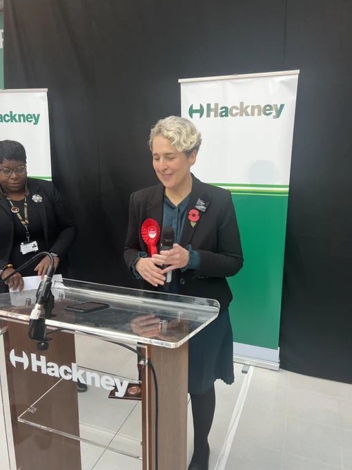 Caroline Woodley standing at the election podium 