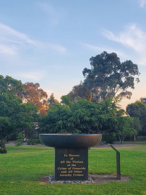 Memorial inscribed with "In Honour of All the Victims of the Crime of Genocide and All Other Atrocity Crimes"
