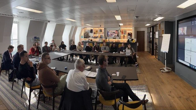 A Lithuanian delegation and Scottish Government colleagues sat watching a presentation 