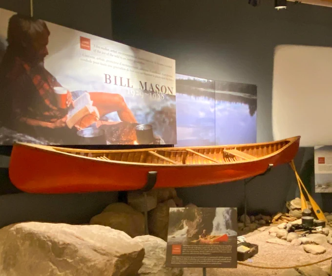 Bill Mason's 16-foot red Chestnut Prospector canoe as it was displayed at the current museum.