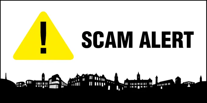 A hazard sign, with text that reads: "Scam Alert".