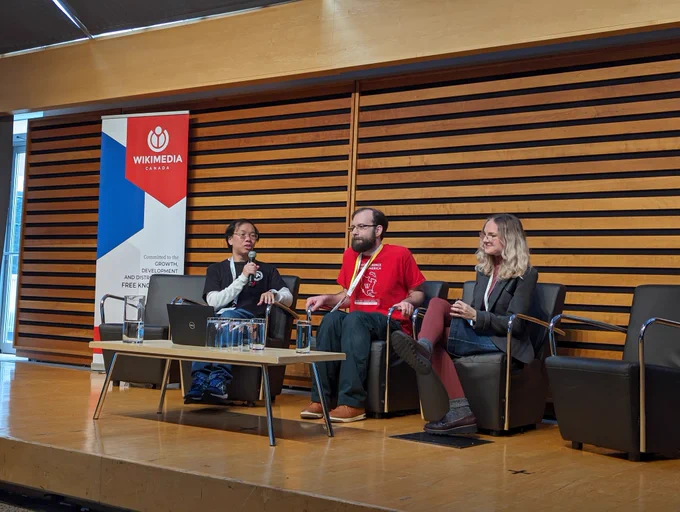 User:OhanaUnited, User:Pharos, and Maryana Pinchuk sit on a conference panel.