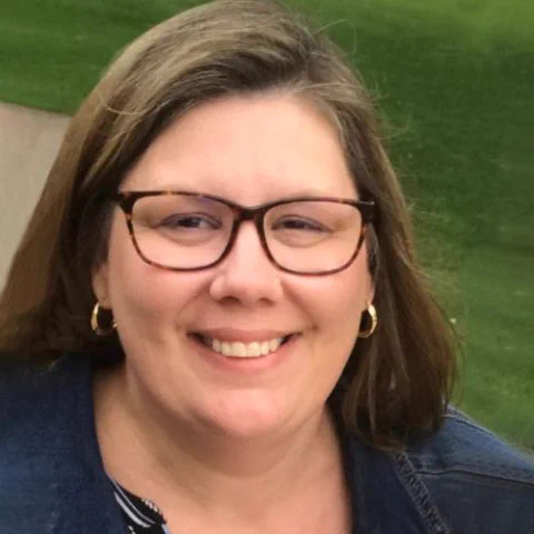 Image of a woman smiling.