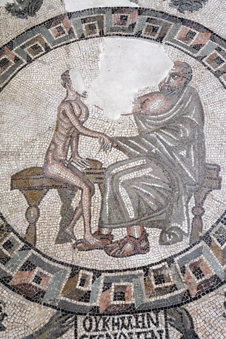 mosaic of a doctor holding the hand of a very sick looking man.