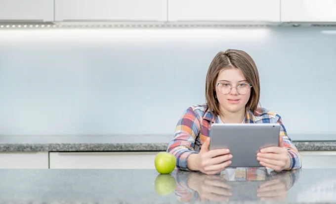 Girl with Down's syndrome at computer