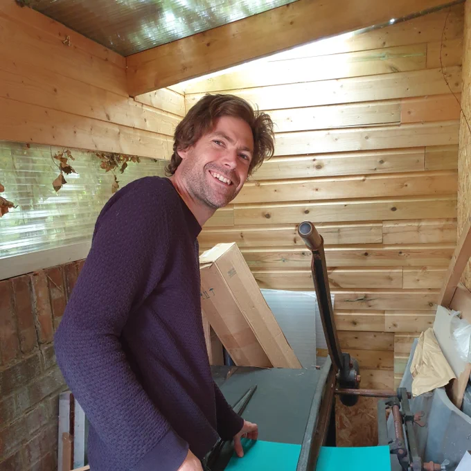 David cutting paper on our nineteenth century Krause board shear.