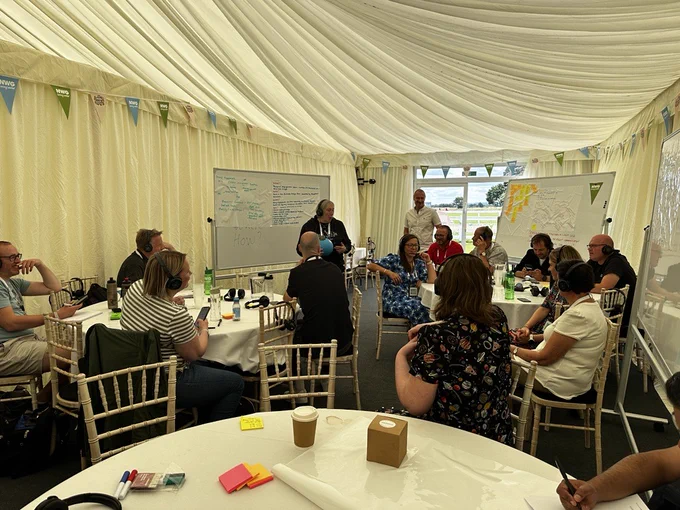 Room full of people in a marquee