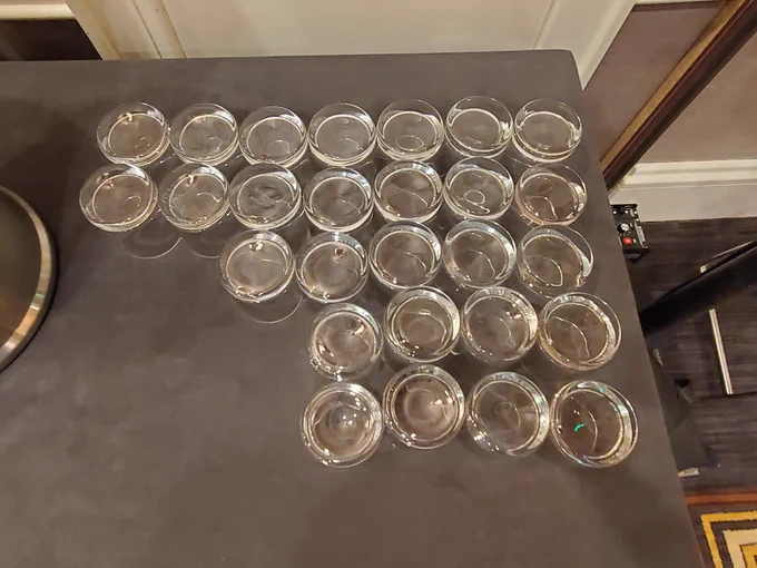 A picture of cups. One way to count going from top to bottom is 2 rows of 7, then one row of 5, then 2 rows of 4, all right-aligned.