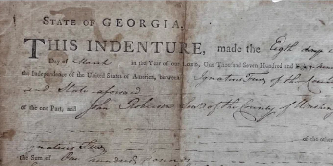 Aged copy of paperwork from Georgia granting Emory its original land following the forced removal of the Muscogee