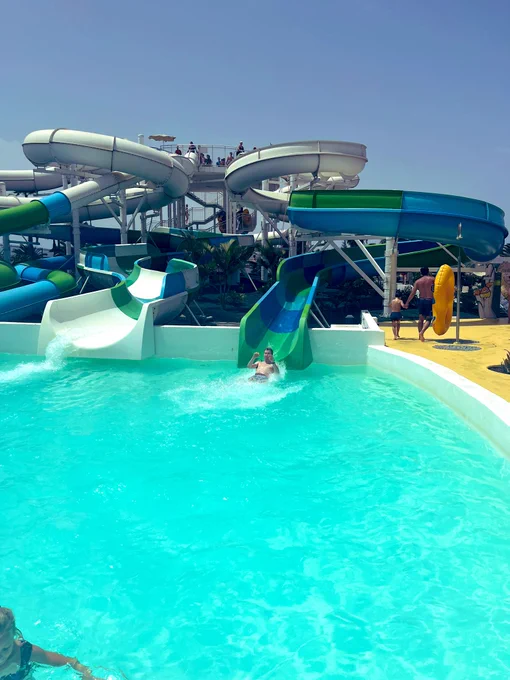 Stephen coming off slide into water