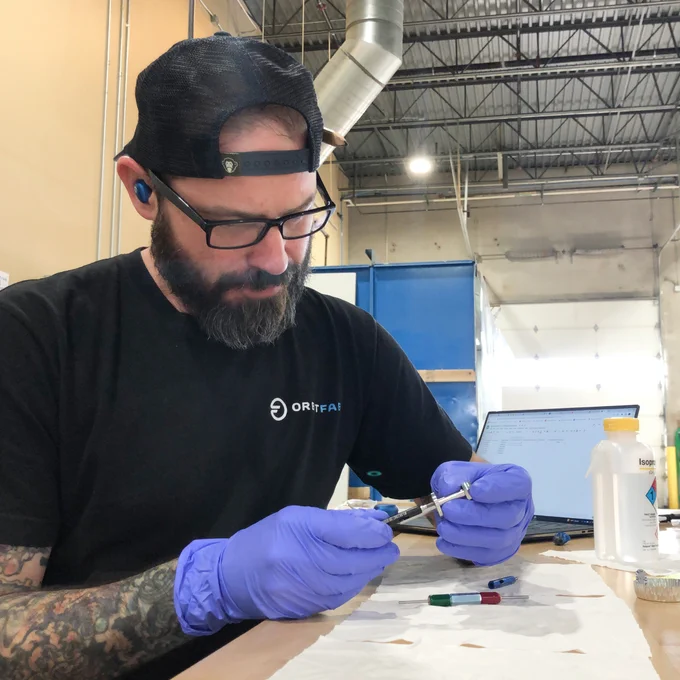 Sculptor Dave doing thread inspection