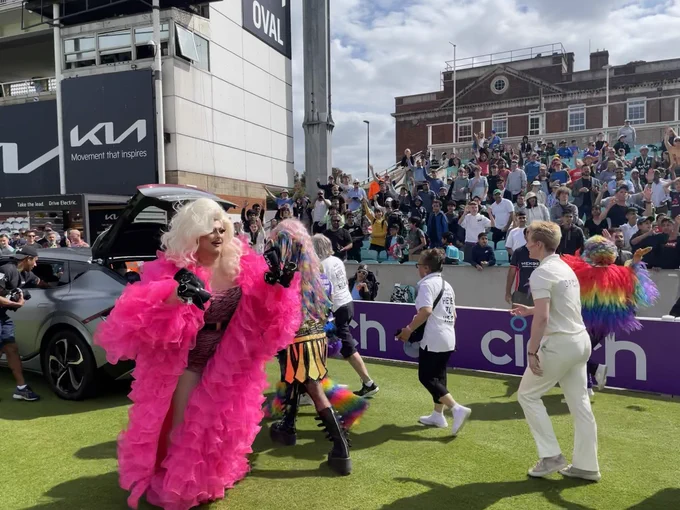 Drag queens and kings prepare to throw T-shirts into the Oval crowd
