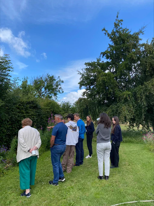 Group of people gather in the gardens