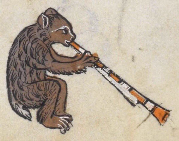 A medieval drawing of a bear playing a long instrument that looks like a pipe
