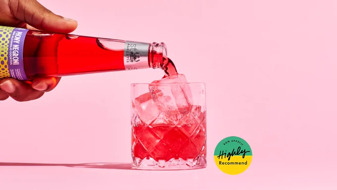 St. Agrestis's Phony Negroni, a non-alcoholic negroni dupe, being poured into a glass over ice.