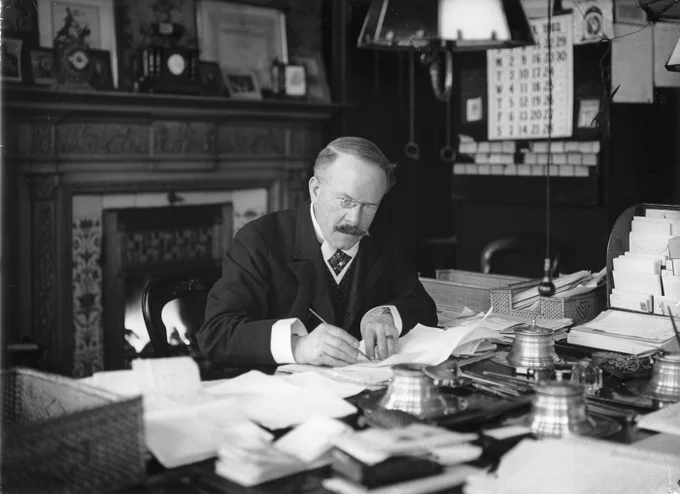 Dr Barnardo working at his desk.