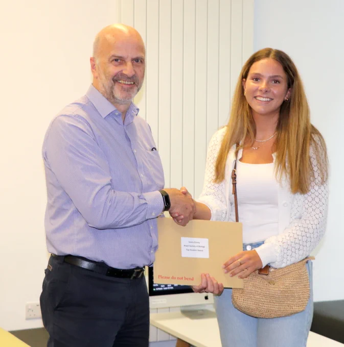Head of department presents prize to Laura Gresty